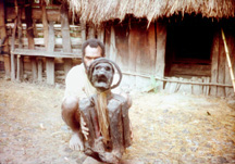 Papua, New Guinea - A villager with his mummified mother